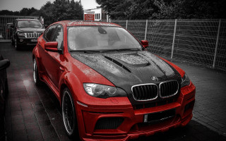 Red car street fence european - a fence and a fenced in area free wallpaper