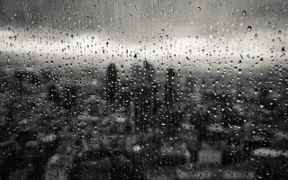 Window rain drops city buildings 2 - a dark sky free wallpaper
