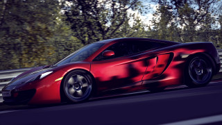 Red sports car driving road 24 - a shadow of a tree free wallpaper