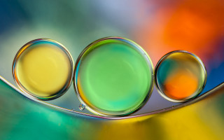 Three bubbles spoon multicolored background - background behind them free wallpaper