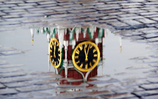 Clock reflection puddle city snow - a puddle of water free wallpaper