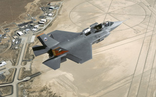 Fighter jet desert town circular - over a desert landscape free wallpaper