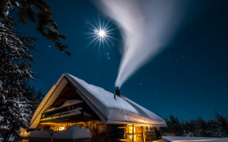 Snowy house starry night fireworks - the roof free wallpaper