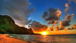 Sunset tropical beach mountain clouds - a tropical beach free wallpaper