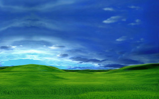 Green field blue sky clouds 6 - a green field in the foreground free wallpaper