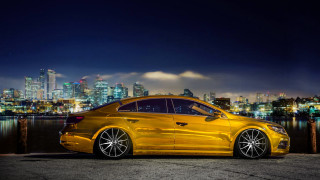 Yellow car night cityscape lights - a city skyline in the background free wallpaper for desktop
