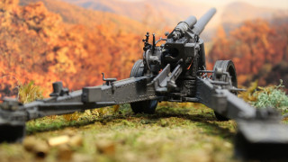 Toy gun grassy hill mountain - free autumn wallpaper