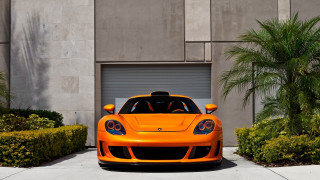 Orange sports car palm trees 3 - bright color free wallpaper