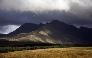 Mountain range trees cloudy sky 2 - dramatic light free wallpaper