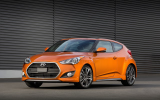 Orange car building black door - an orange car free wallpaper