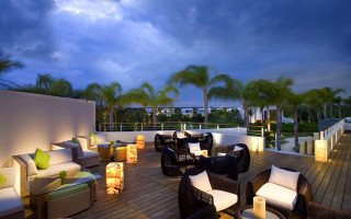 Deck chairs tables lights palm - atmospheric free wallpaper