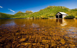 Small house lake mountains trees - a clear blue sky above free wallpaper