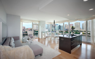 Living room couch window cityscape - ambient light free wallpaper