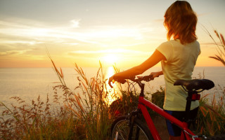 Woman bike ocean sunset scenery - a woman riding free wallpaper