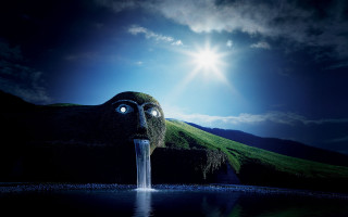 Surreal water face mountain sky - a bright sun free wallpaper