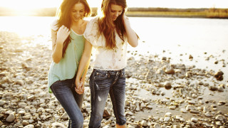 Beach two women holding hands - a rocky beach next free wallpaper for desktop