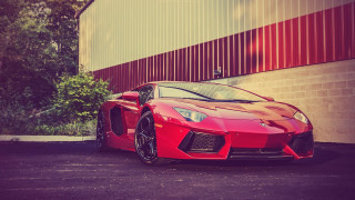 Red sports car city night 4 - a red stripe free wallpaper