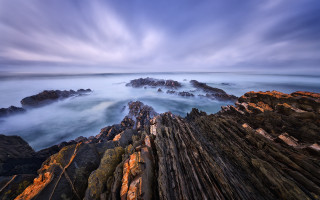 Rocky beach longexposure clouds shoreline - a rocky shore line free wallpaper