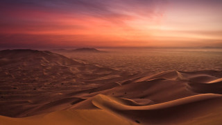 Sunset desert sand dunes mountains - a sunset over a desert free wallpaper