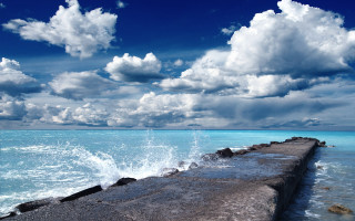 Long concrete wall ocean cloudy - white cloud above free wallpaper