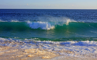 Wave breaking beach ocean sky - the ocean in the background free wallpaper