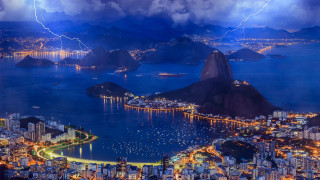 City lightning storm mountains water - a lightning bolt in the sky above free wallpaper