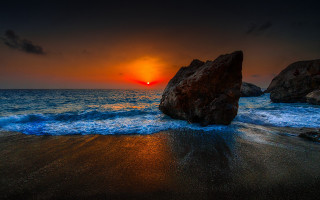 Sunset ocean rock backlight beach - a sunset over the ocean free wallpaper