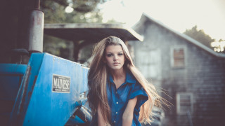 Woman leaning blue truck barn - a blue truck free wallpaper