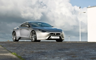 Silver sports car cloudy sky 2 - a white building free wallpaper