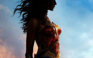 Woman wonder costume cloudy sky - feminist free wallpaper