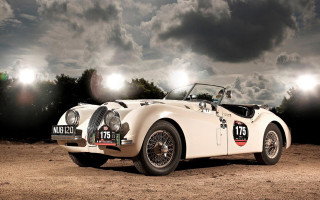 White sports car dirt field - roof free wallpaper