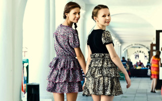 Two women hallway smiling dresses - fashion free wallpaper