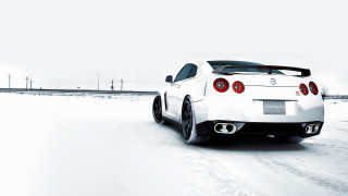 White sports car snowy road 3 - a white sports car free wallpaper for desktop