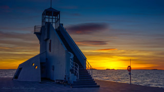 Lighthouse stairway sunset ocean boat - great composition free wallpaper