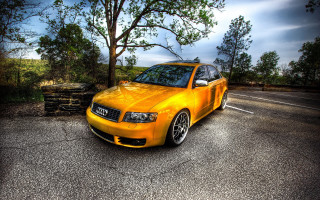 Yellow car autumn leaves fence - the side of a road next free wallpaper