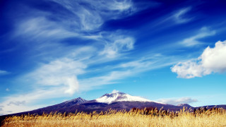 Mountain field clouds blue sky - white cloud free wallpaper