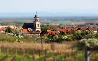 Small town church tower bokeh - a small town free wallpaper