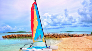 Sailboat beach rockwall person sunset - anne rigney free wallpaper for desktop
