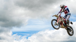 Dirt bike trick cloudy sky - a trick in the air free wallpaper