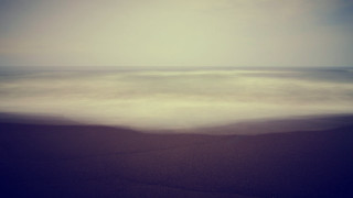 Blurry ocean beach wave sunset - soft focus free wallpaper for desktop