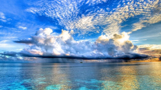 Large water clouds boat sunset - colorful cloud free wallpaper