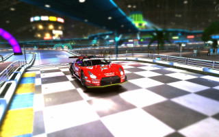 Red sports car checkered road - a neon light free wallpaper