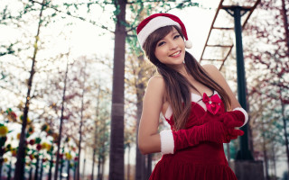 Woman santa hat gloves park - a ladder in the background free wallpaper