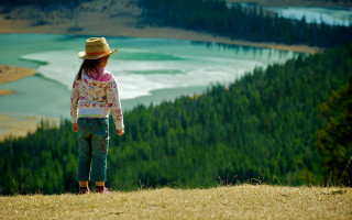 Little girl hillside lake forest - a lake in the distance free wallpaper