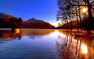 Lake boat mountain sunset reflection - a boat free wallpaper for desktop