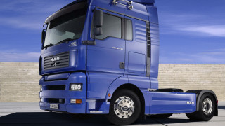 Blue semi truck parking lot - a parking lot next free wallpaper