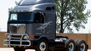 Semi truck parking lot tree - a large semi truck free wallpaper