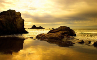 Bascove beach rocks sunset ocean - a sunset in the background and a body of water free wallpaper