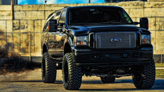 Black truck big tire road - a black truck free wallpaper