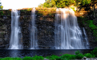 Waterfall man boat river nature - a body of water below free wallpaper